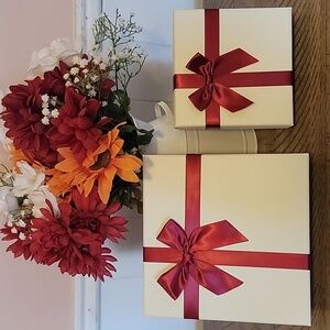 2 Gift Boxes With Red Ribbons